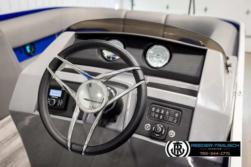 Slide: The Image of Steering console of 2025 Bennington LTFBSE boat with modern controls and sleek design. - 29