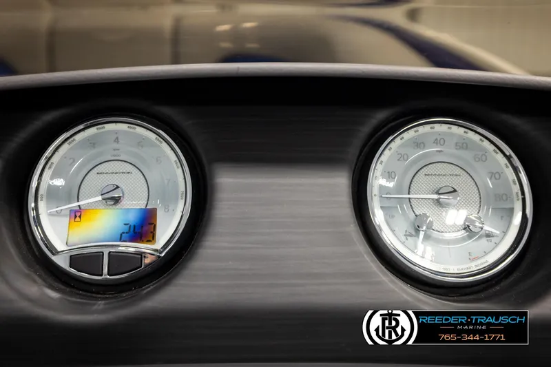 Slide: The Image of Dashboard of 2025 Bennington LTFBSE boat with dual gauges and digital display. - 33