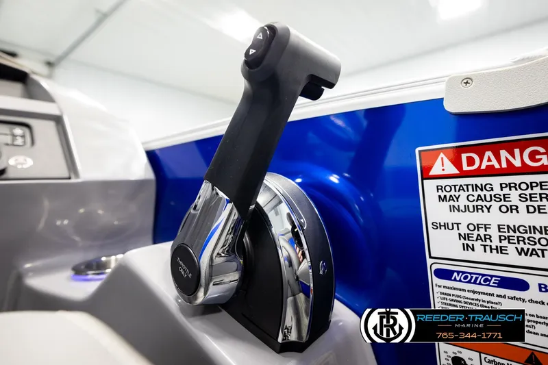 Slide: The Image of Close-up of 2025 Bennington LTFBSE throttle control with safety warning label. - 37