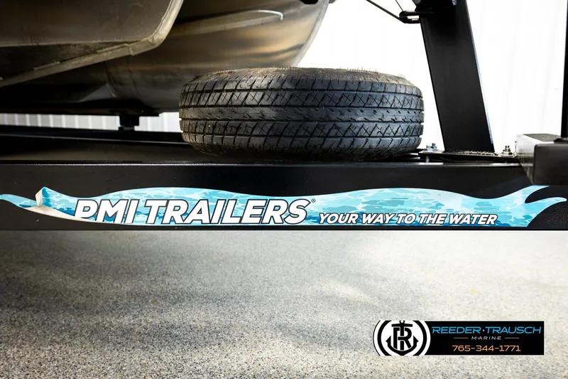 Slide: The Image of Trailer with spare tire, featuring PMI Trailers branding and Reeder-Trausch Marine contact information. - 51