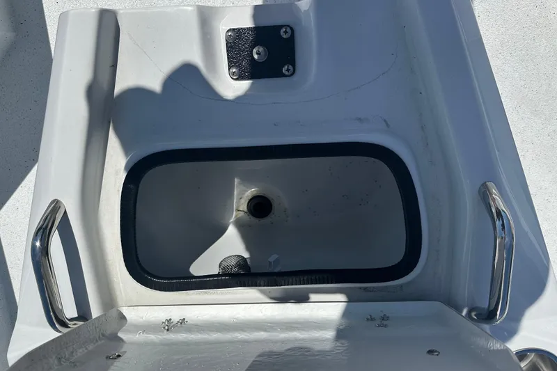 Slide: The Image of 2026 Xpress H20B Bay boat with sleek blue exterior design. - 12