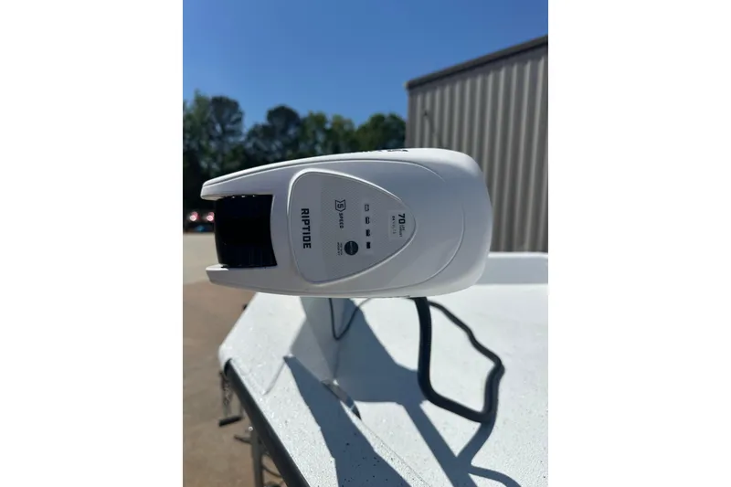 Slide: The Image of 2026 Xpress H20B Bay boat interior with storage compartments and cup holders. - 7