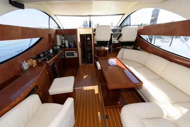 Slide: The Image of Luxurious interior of 2007 Fairline Phantom 46 yacht with elegant seating and wooden finishes. - 17