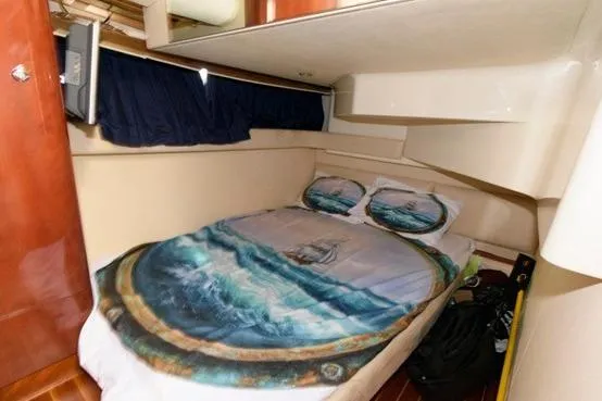Slide: The Image of 2007 Fairline Phantom 46 yacht cabin with nautical-themed bedding. - 19