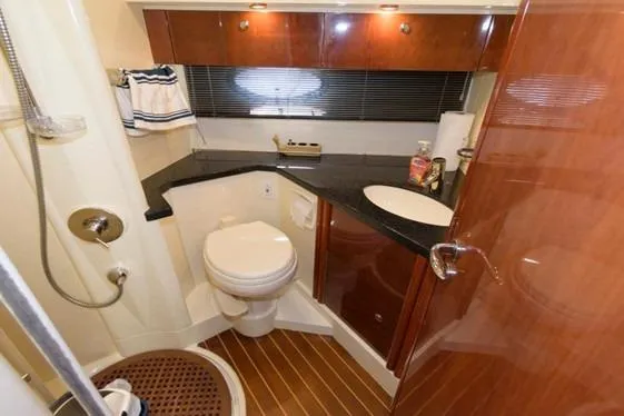 Slide: The Image of Luxurious bathroom in 2007 Fairline Phantom 46 yacht with modern fixtures and wood accents. - 20