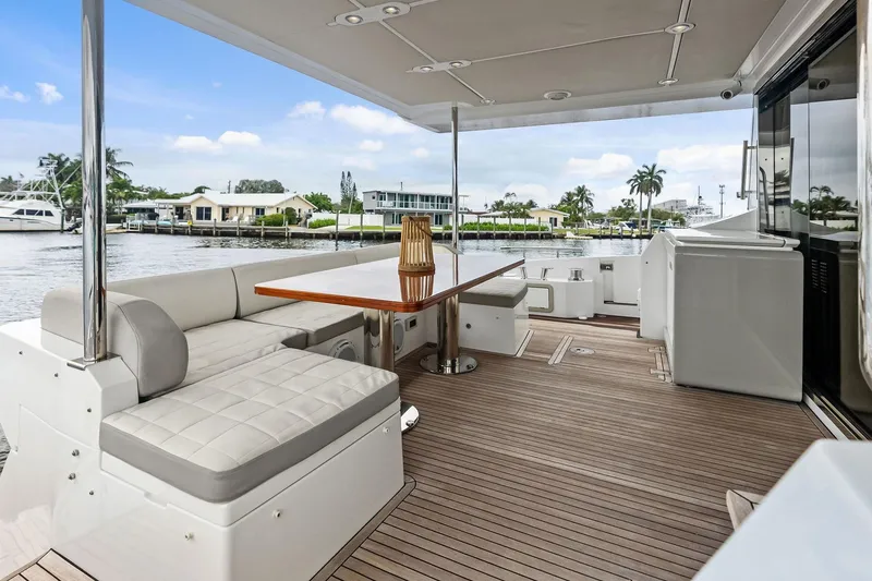 Slide: The Image of Luxurious 2017 Azimut Fly 72 yacht deck with elegant seating and waterfront view. - 15