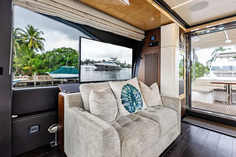 Slide: The Image of Luxurious interior of 2017 Azimut Fly 72 yacht with plush seating and scenic window view. - 19