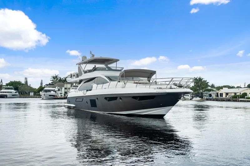 Slide: The Image of Luxury 2017 Azimut Fly 72 yacht on calm water under blue sky. - 2