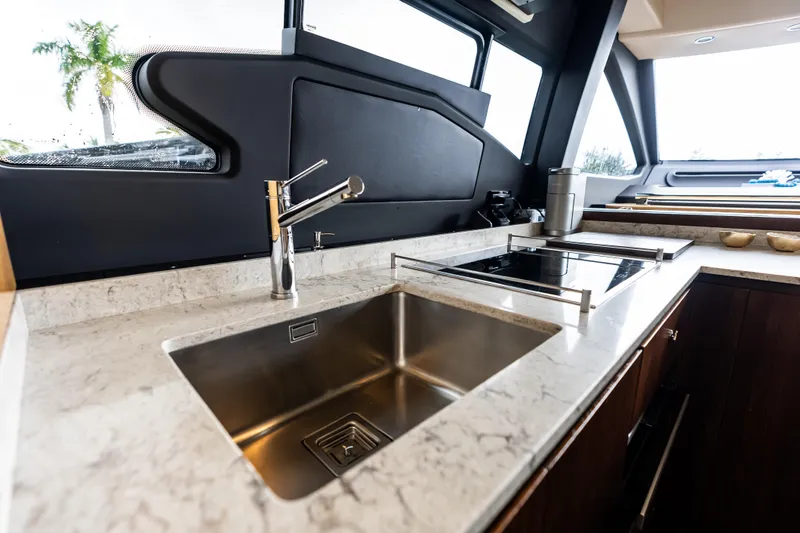 Slide: The Image of Luxurious kitchen interior of 2017 Azimut Fly 72 yacht with modern sink and stovetop. - 24