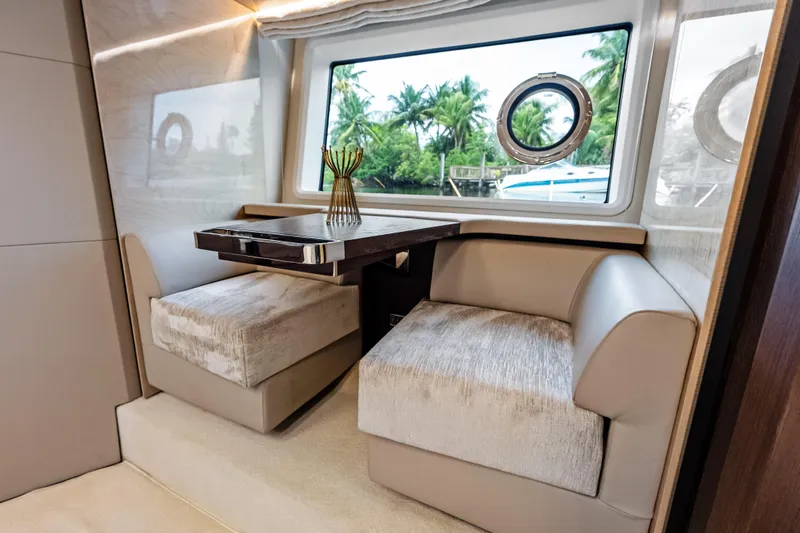 Slide: The Image of Luxurious interior of 2017 Azimut Fly 72 yacht with elegant seating and window view. - 34