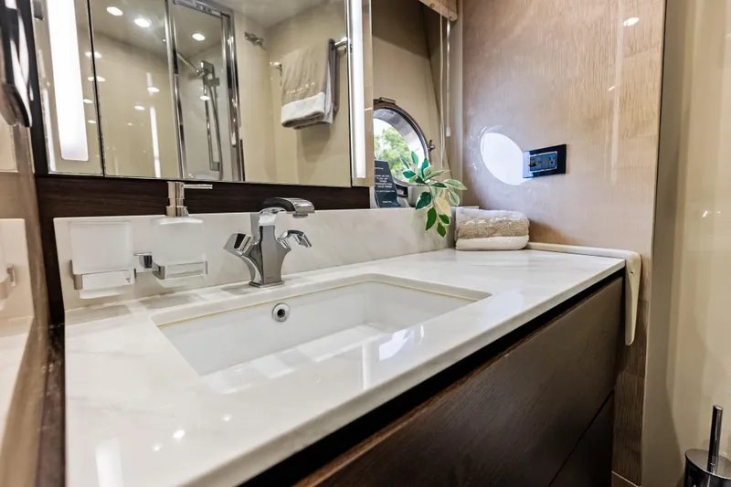 Slide: The Image of Luxurious bathroom interior of 2017 Azimut Fly 72 yacht with modern sink and elegant decor. - 40