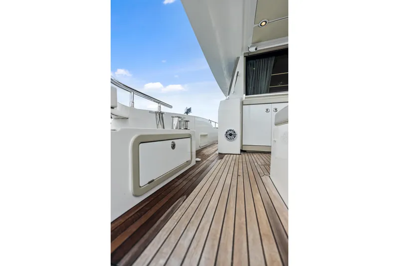 Slide: The Image of Azimut Fly 72 yacht deck, 2017 model, featuring sleek wooden flooring and modern design. - 54