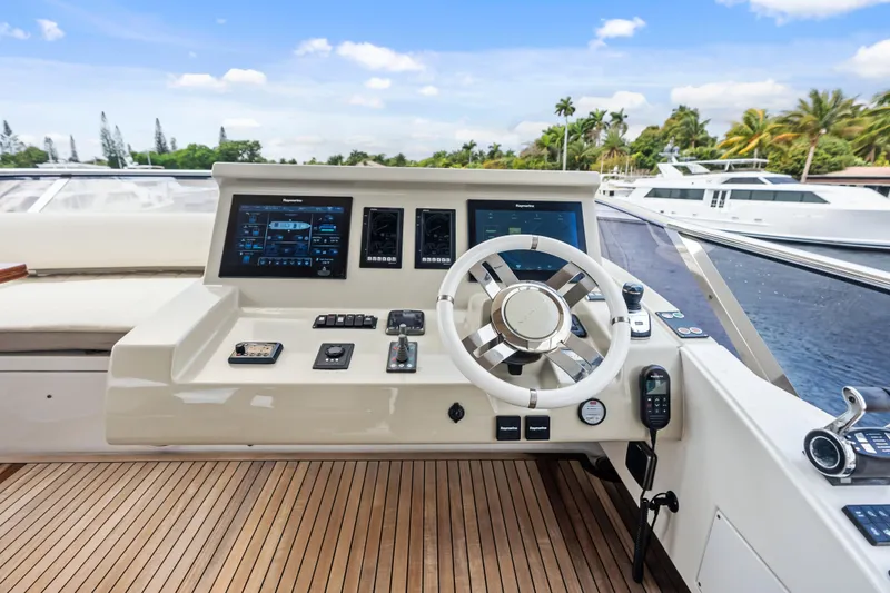 Slide: The Image of Cockpit of 2017 Azimut Fly 72 yacht with modern navigation controls and steering wheel. - 57