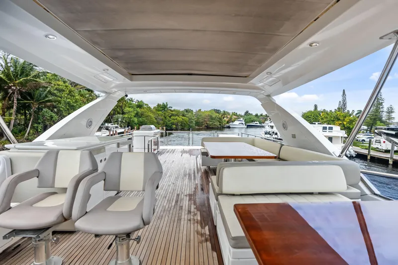 Slide: The Image of Luxurious 2017 Azimut Fly 72 yacht interior with elegant seating and scenic marina view. - 62