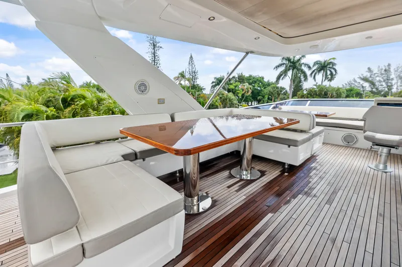 Slide: The Image of Luxurious 2017 Azimut Fly 72 yacht deck with elegant seating and polished wooden table. - 65