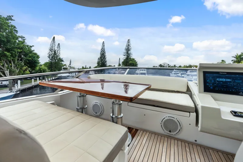 Slide: The Image of Luxurious 2017 Azimut Fly 72 yacht deck with seating, table, and control panel. - 66