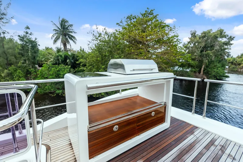 Slide: The Image of Luxury outdoor kitchen on 2017 Azimut Fly 72 yacht, featuring sleek design and scenic water views. - 71