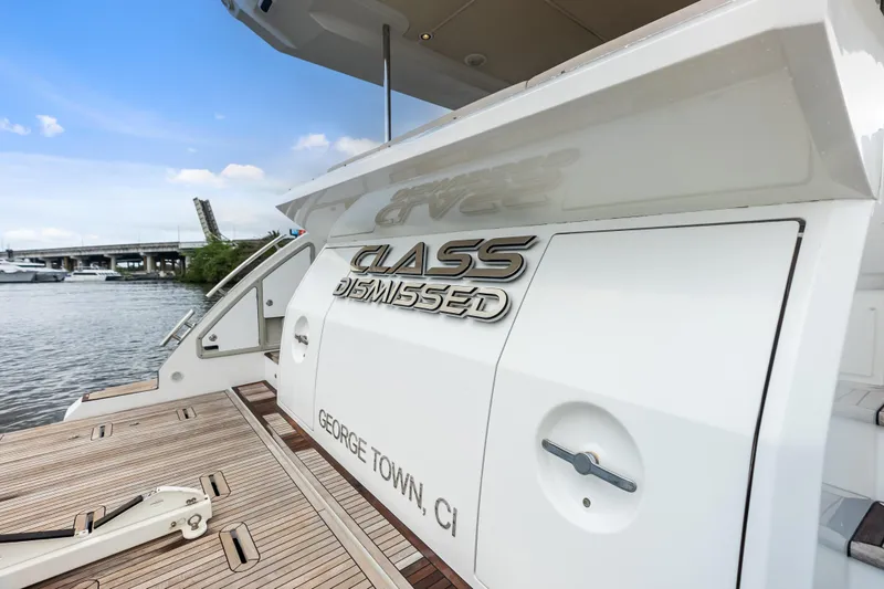 Slide: The Image of Azimut Fly 72 yacht, 2017 model, docked with "Class Dismissed" nameplate, George Town, CI. - 73