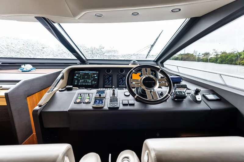 Slide: The Image of Helm of 2017 Azimut Fly 72 yacht with modern navigation controls and steering wheel. - 74