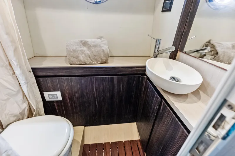 Slide: The Image of Luxurious bathroom interior of 2017 Azimut Fly 72 yacht with modern sink and toilet. - 77