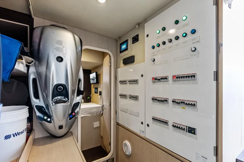 Slide: The Image of Electrical control panel inside 2017 Azimut Fly 72 yacht, featuring modern equipment and sleek design. - 81