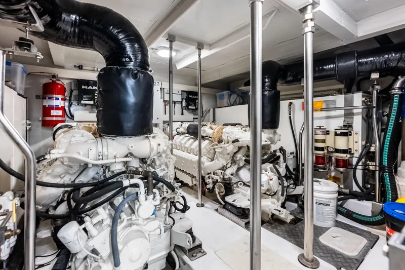 Slide: The Image of Engine room of 2017 Azimut Fly 72 yacht, featuring dual MAN engines and equipment. - 84