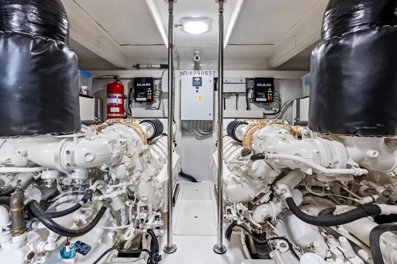 Slide: The Image of Engine room of 2017 Azimut Fly 72 yacht, featuring dual MAN engines and safety equipment. - 85