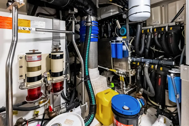 Slide: The Image of Engine room of 2017 Azimut Fly 72 yacht, showcasing complex machinery and equipment. - 91