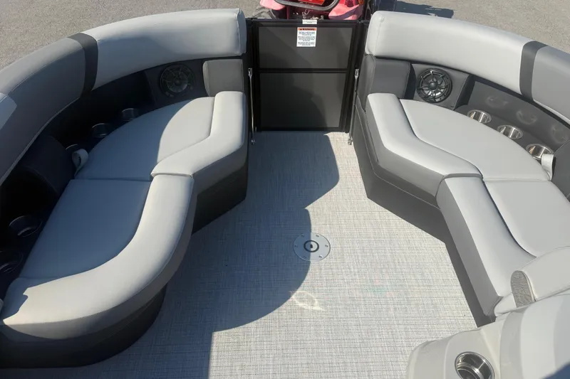 Slide: The Image of Luxurious seating area on 2026 Trifecta 22ULCS pontoon boat with cup holders and speakers. - 11
