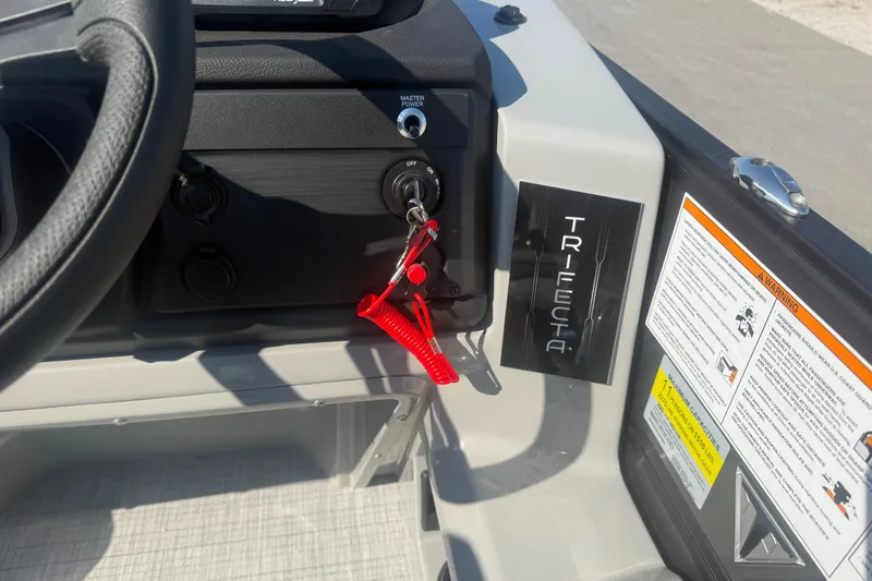 Slide: The Image of 2026 Trifecta 22ULCS dashboard with ignition key and safety warnings. - 13