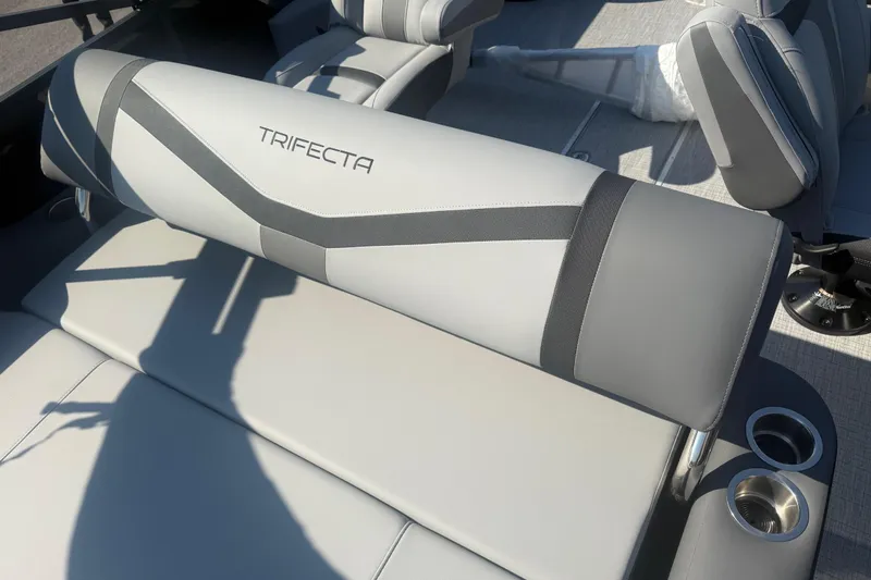 Slide: The Image of 2026 Trifecta 22ULCS boat interior with sleek gray seating and cup holders. - 15