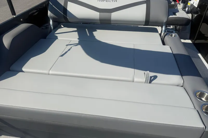 Slide: The Image of Luxurious seating on 2026 Trifecta 22ULCS boat with cup holders and sleek design. - 16