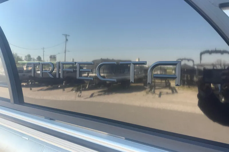 Slide: The Image of 2026 Trifecta 22ULCS boat with reflective surface and logo. - 5