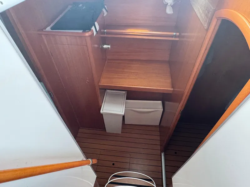 Slide: The Image of Interior of a 2000 Lagoon 380 yacht with wooden cabinetry and storage space. - 20