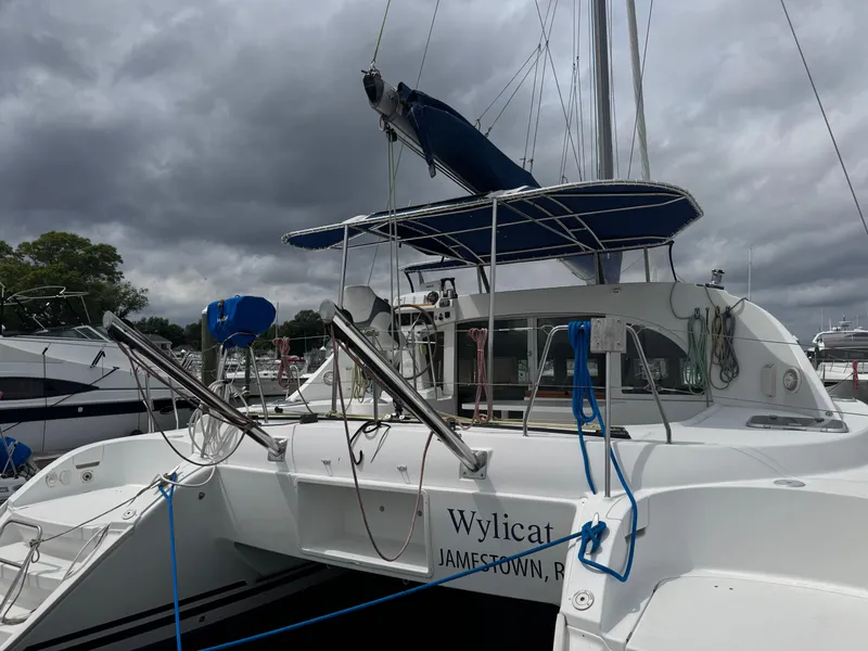 Slide: The Image of Lagoon 380 catamaran from 2000 docked under cloudy skies. - 4