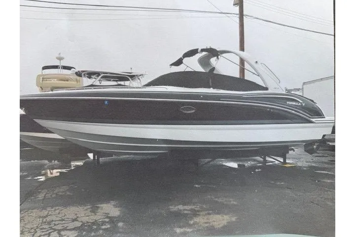 The Image of 2015 Formula 310 Bowrider boat on display in a parking lot. - 0