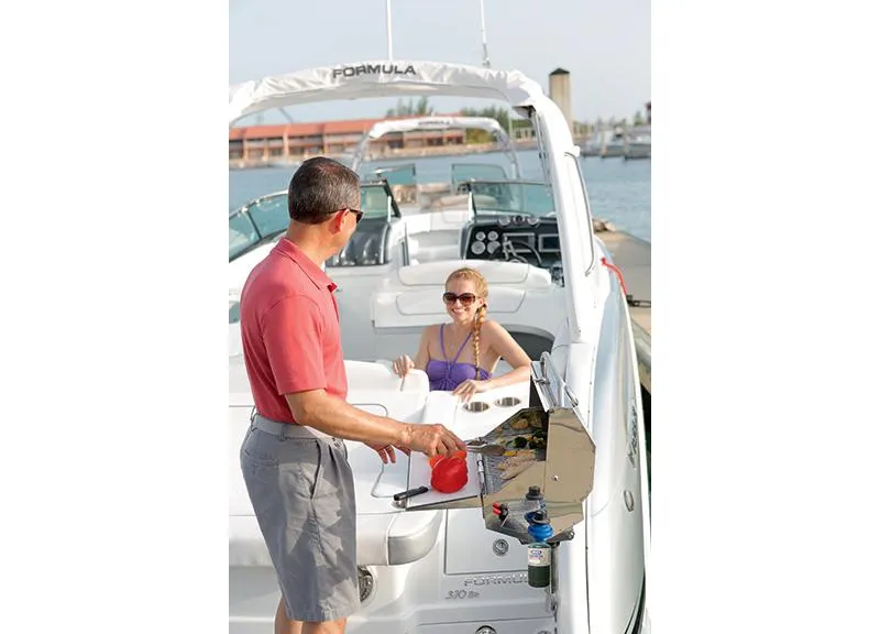 Slide: The Image of Manufacturer Provided Image: Man and girl enjoying a day on a 2015 Formula 310 Bowrider boat. - 12