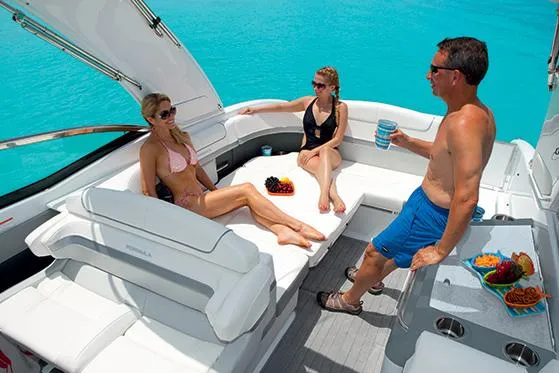 Slide: The Image of Manufacturer Provided Image: 2015 Formula 310 Bowrider with people relaxing on deck in clear blue water. - 13