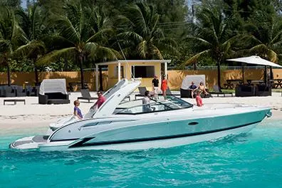 Slide: The Image of Manufacturer Provided Image: 2015 Formula 310 Bowrider cruising near a tropical beach with palm trees. - 3