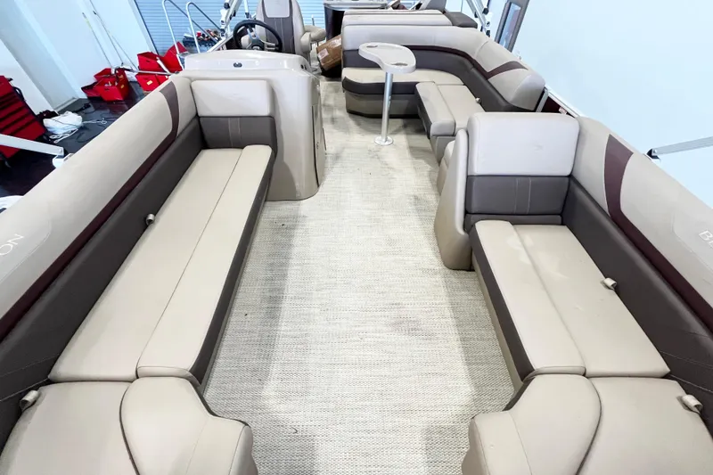 Slide: The Image of Interior of 2020 Bennington SX25 pontoon boat with spacious seating and modern design. - 14