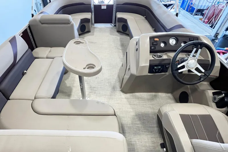 Slide: The Image of 2020 Bennington SX25 boat interior with plush seating and modern helm controls. - 15