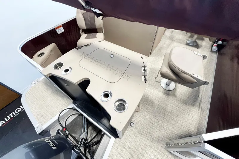 Slide: The Image of Interior of a 2020 Bennington SX25 boat featuring seating and control panel. - 9