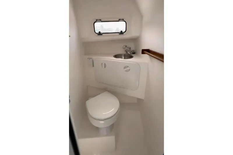 Slide: The Image of Compact bathroom in 2026 Seaport Commander 2800 boat with toilet and sink. - 16
