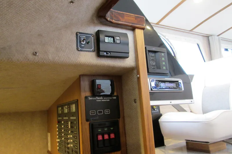 Slide: The Image of Control panel inside 2026 Seaport Commander 2800 boat, featuring various electronic systems. - 21