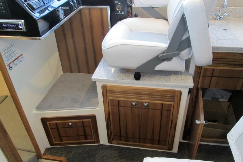 Slide: The Image of 2026 Seaport Commander 2800 interior with cushioned seating and wooden cabinetry. - 22