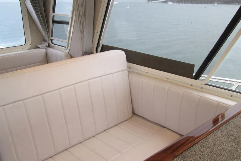 Slide: The Image of Interior of 2026 Seaport Commander 2800 boat with beige seating and ocean view. - 23