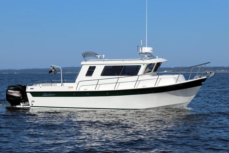 Slide: The Image of 2026 Seaport Commander 2800 boat cruising on open water under clear blue sky. - 7