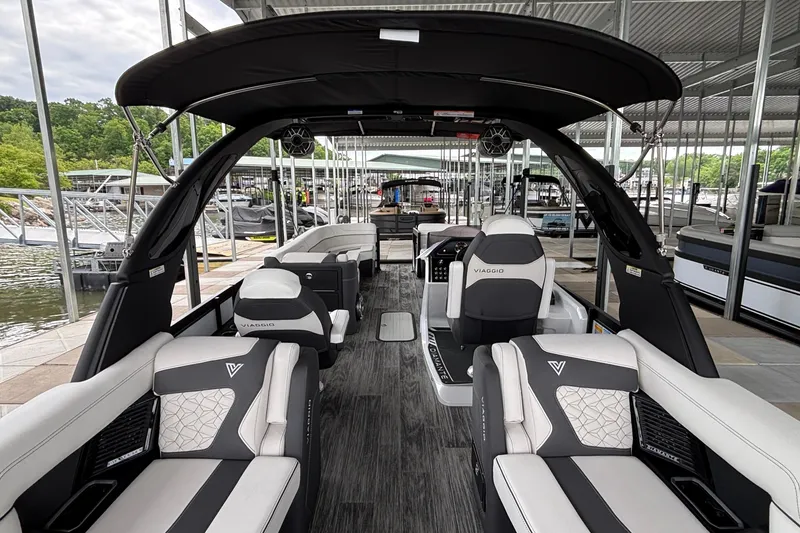 Slide: The Image of Luxurious 2026 Viaggio D26U boat interior with sleek seating and modern design at a marina. - 19