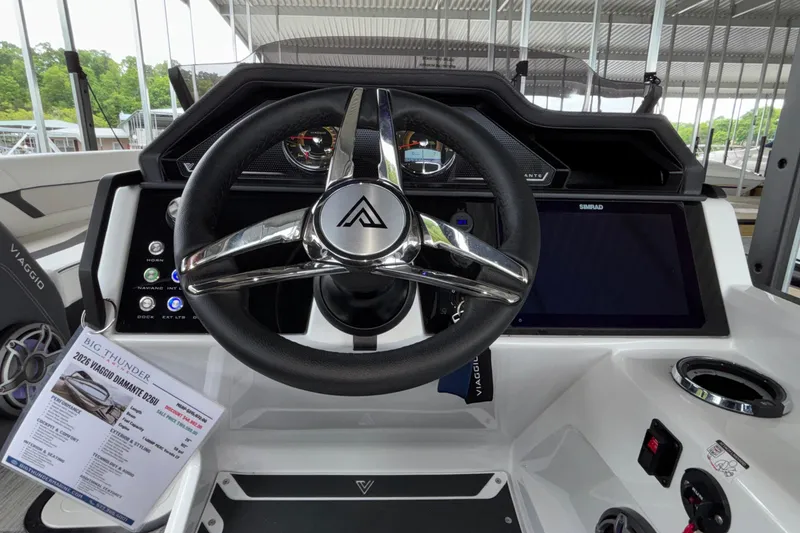 Slide: The Image of Steering wheel and dashboard of 2026 Viaggio D26U boat, featuring modern controls and display. - 21