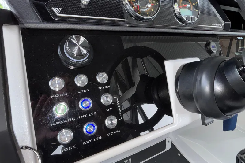 Slide: The Image of Control panel of 2026 Viaggio D26U boat with illuminated buttons and steering wheel. - 22